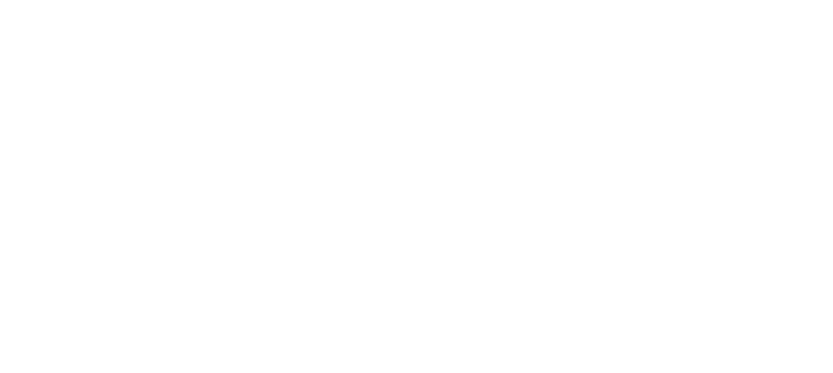 Pildil on inimene, taustal paistab tehas ja suur korsten kust väljub suurel hulgal suitsu.